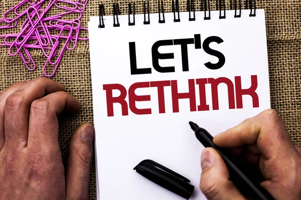 Text sign showing Let Us Rethink. Conceptual photo Give people time to think things again Remodel Redesign written by Man Holding Marker on Notebook Book on the jute background Pins next to it — Stock Photo, Image