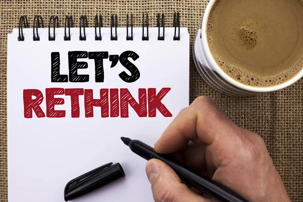 Text sign showing Let Us Rethink. Conceptual photo Give people time to think things again Remodel Redesign written by Man Holding Marker on Notebook Book on the jute background Coffee Cup. — Stock Photo, Image