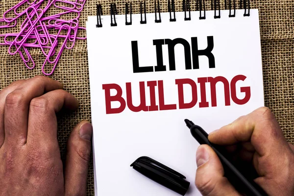 Text sign showing Link Building. Conceptual photo Process of acquiring hyperlinks from other websites Connection written by Man Holding Marker on Notebook Book on the jute background Pins next to it — Stock Photo, Image