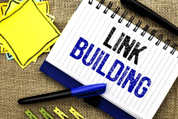 Conceptual hand writing showing Link Building. Business photo showcasing Process of acquiring hyperlinks from other websites Connection written on Notebook Book on the jute background Clips and Pens — Stock Photo, Image