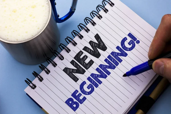 Conceptual hand writing showing New Beginning Motivational Call. Business photo text Fresh Start Changing Form Growth Life written by Man on Notebook Book Holding Marker plain background Cup.