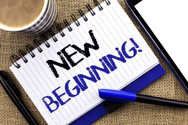 Text sign showing New Beginning Motivational Call. Conceptual photo Fresh Start Changing Form Growth Life written on Notebook Book on the jute background Tablet Coffee Cup and Pens next to it