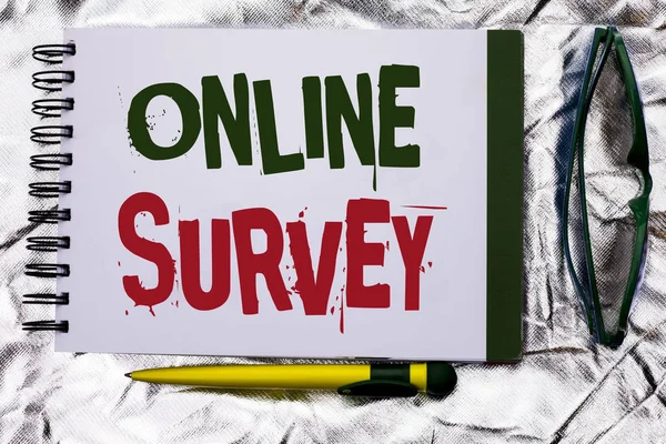 Text sign showing Online Survey. Conceptual photo Digital Media Poll Customer Feedback Opinions Questionnaire written on Notebook Book on the textured background with Pen and Glasses next to it.