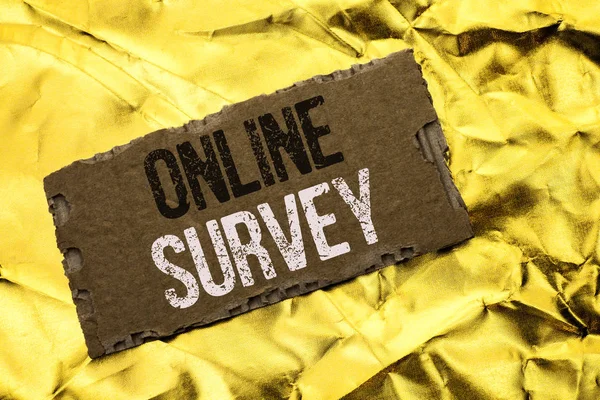 Writing note showing  Online Survey. Business photo showcasing Digital Media Poll Customer Feedback Opinions Questionnaire written on tear Cardboard Piece on the Golden textured background.