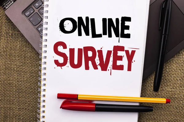 Writing note showing  Online Survey. Business photo showcasing Digital Media Poll Customer Feedback Opinions Questionnaire written on Notebook Book placed on Laptop with jute background Pens — Stock Photo, Image