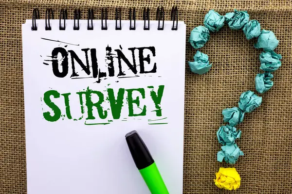 Writing note showing  Online Survey. Business photo showcasing Digital Media Poll Customer Feedback Opinions Questionnaire written on Notebook Book on the jute background Marker Ask for.