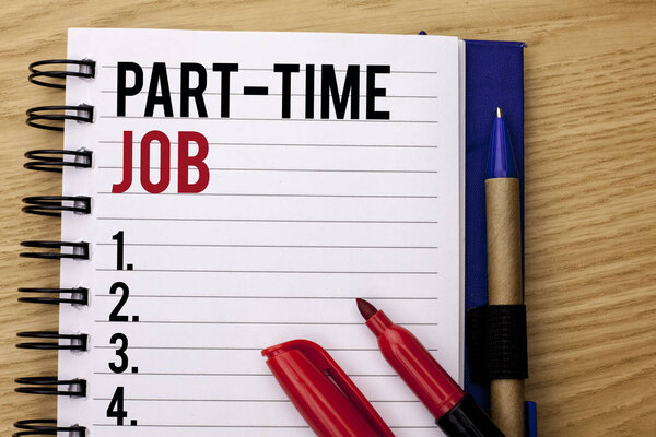 Handwriting text writing Part Time Job. Concept meaning Working a few hours per day Temporary Work Limited Shifts written on Notebook Book on the wooden background Marker and Pencil next to it.