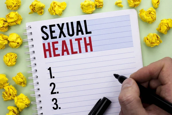 Writing note showing  Sexual Health. Business photo showcasing STD prevention Use Protection Healthy Habits Sex Care written By Man Holding Marker on Notebook Book.