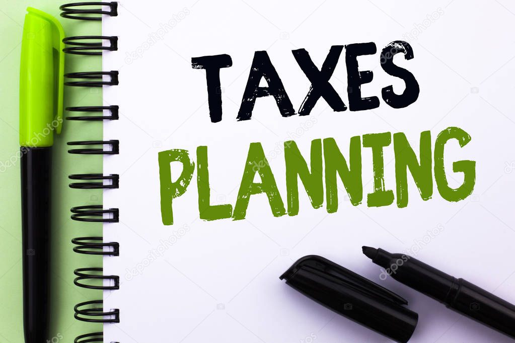 Text sign showing Taxes Planning. Conceptual photo Financial Planification Taxation Business Payments Prepared written on Notebook Book on the Green background Marker and Pen next to it.