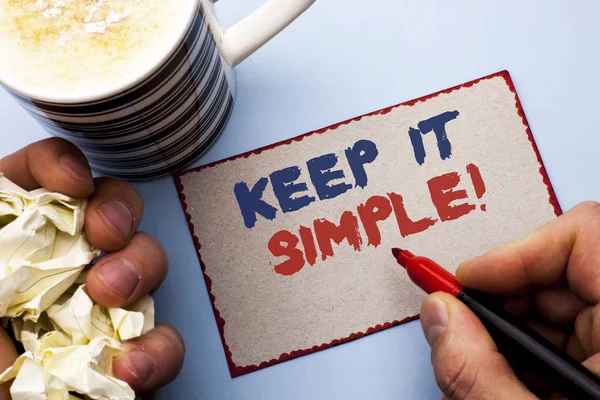 Writing note showing  Keep It Simple Motivational Call. Business photo showcasing Simplify Things Easy Clear Concise Ideas written by Man on Cardboard Piece Holding Marker on the plain background — Stock Photo, Image