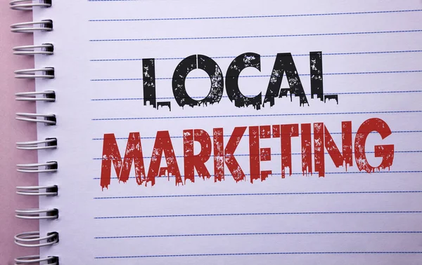 Word writing text Local Marketing. Business concept for Regional Advertising Commercial Locally Announcements written on Notebook Book on the plain background.