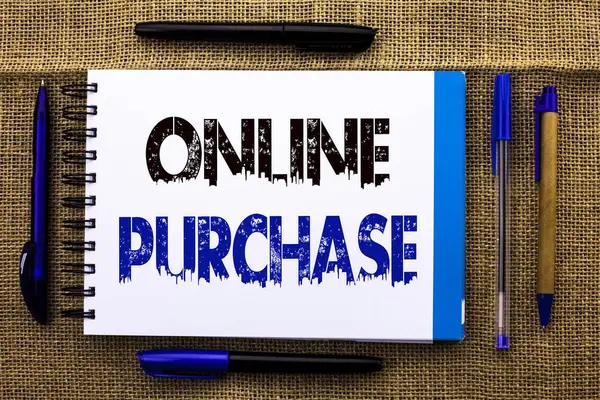 Conceptual hand writing showing Online Purchase. Business photo text Buy things on the net Go shopping without leaving home written on Notebook Book on the jute background Pens next to it.