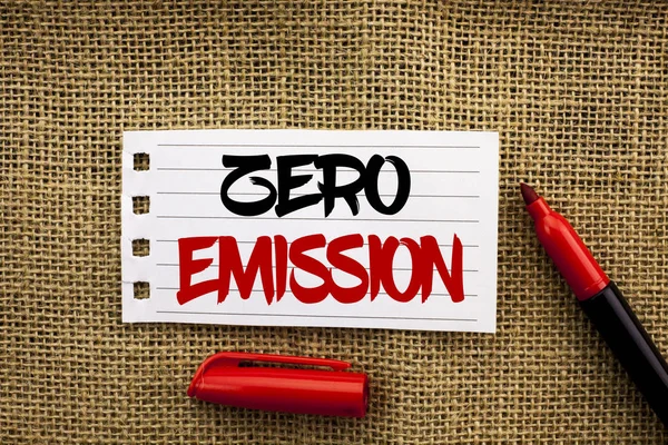 Word writing text Zero Emission. Business concept for Engine Motor Energy Source that emits no waste products written on Notebook Paper on the jute background with marker next to it.