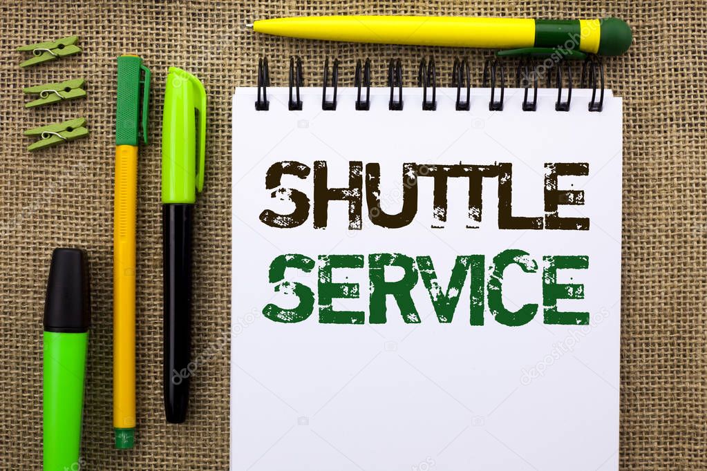 Word writing text Shuttle Service. Business concept for Transportation Offer Vacational Travel Tourism Vehicle written on Notebook Book on the jute background Pens and Clips next to it.