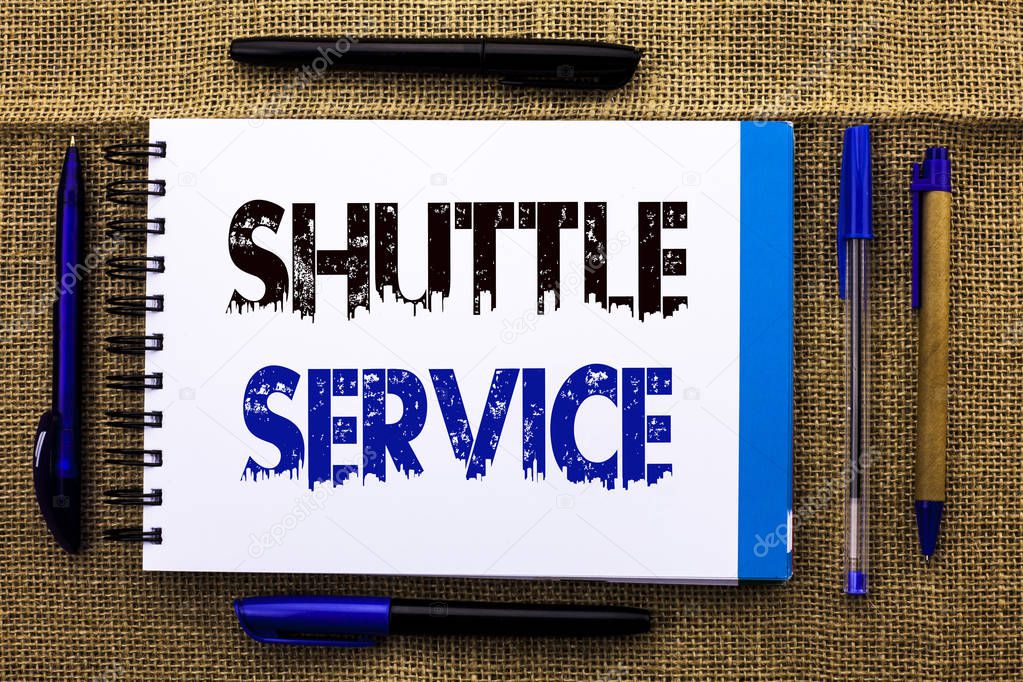 Conceptual hand writing showing Shuttle Service. Business photo text Transportation Offer Vacational Travel Tourism Vehicle written on Notebook Book on the jute background Pens next to it.