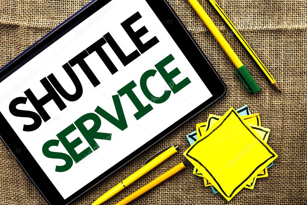 Text sign showing Shuttle Service. Conceptual photo Transportation Offer Vacational Travel Tourism Vehicle written on Tablet on the jute background Pens Pencil and Sticky Note Papers