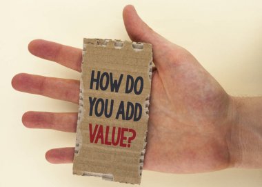 Conceptual hand writing showing How Do You Add Value Question. Business photo text Bring business progress contribute earn written on Tear Cardboard Piece on the plain background Hand. clipart