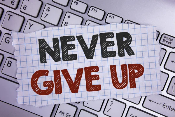 Text sign showing Never Give Up. Conceptual photo Be persistent motivate yourself succeed never look back written on Tear Notebook paper placed on the Laptop. — Stock Photo, Image