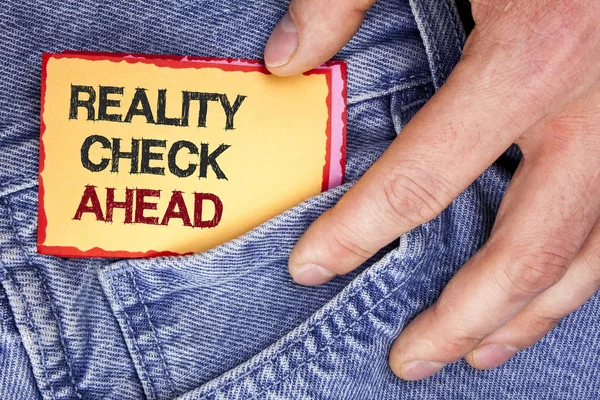 Word writing text Reality Check Ahead. Business concept for Unveil truth knowing actuality avoid being sceptical written on Sticky Note Paper holding by man on the Jeans background. — Stock Photo, Image