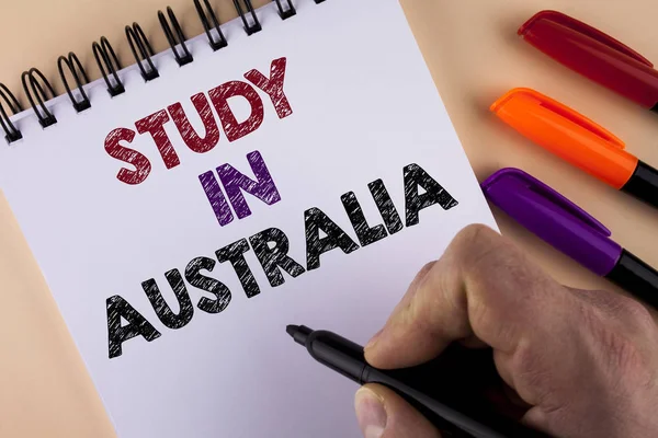 Word writing text Study In Australia. Business concept for Graduate from oversea universities great opportunity written by Man with Marker on Notepad on the plain background Markers next to it — Stock Photo, Image