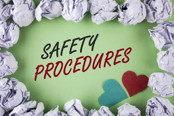 Text sign showing Safety Procedures. Conceptual photo Follow rules and regulations for workplace security written on plain green background within White Paper Balls Hearts next to it.