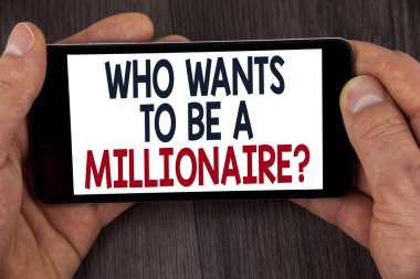 Writing note showing  who Wants To Be A Millionaire Question. Business photo showcasing Earn more money applying knowledge written on Mobile Phone Screen holding by man on the wooden background. clipart