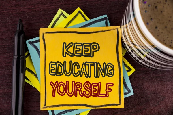 Writing note showing  Keep Education Yourself. Business photo showcasing Learning skills with your own competencies written on Sticky Note paper on Wooden background Coffee Cup and Marker — Stock Photo, Image