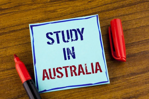 Word writing text Study In Australia. Business concept for Graduate from oversea universities great opportunity written on Sticky note paper on the Wooden background Marker next to it. — Stock Photo, Image