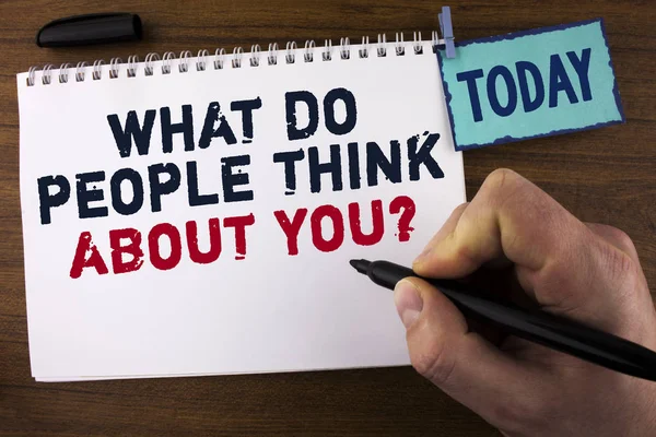 Handwriting text writing What Do People Think About You Question. Concept meaning This is how others judge you written by Man on Notepad holding Marker on wooden background Today Clip. — Stock Photo, Image