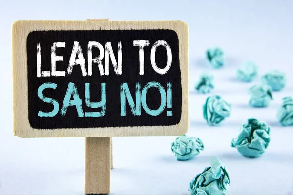 Writing note showing  Learn To Say No Motivational Call. Business photo showcasing Encouragement advice tips morality values written on Wooden Notice Board plain background Paper Balls next to it. — Stock Photo, Image