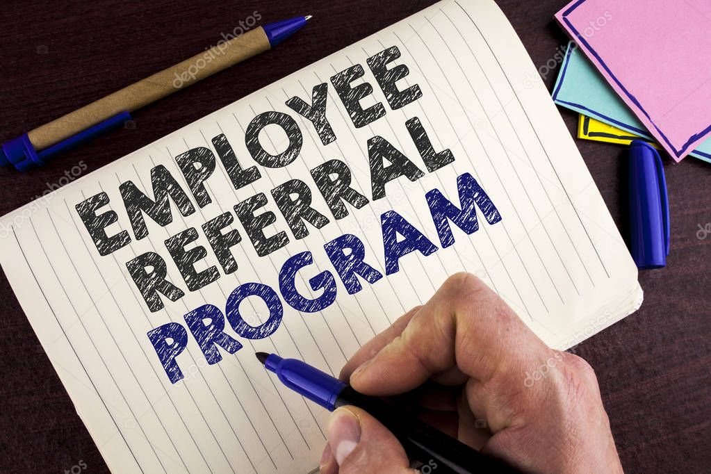 Conceptual hand writing showing Employee Referral Program. Business photo showcasing Recommend right jobseeker share vacant job post written by Man on Notebook Book on wooden background Pen.