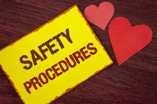 Conceptual hand writing showing Safety Procedures. Business photo text Follow rules and regulations for workplace security written on Yellow Sticky note paper on wooden background Hearts. — Stock Photo, Image