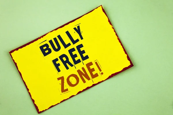Writing note showing  Bully Free Zone Motivational Call. Business photo showcasing creating abuse free school college life written on Yellow Colored Sticky note paper on plain background. — Stock Photo, Image