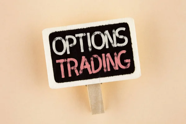 Handwriting text Options Trading. Concept meaning Options trading investment commodities stock market analysis written on Wooden Notice Board on the plain background.