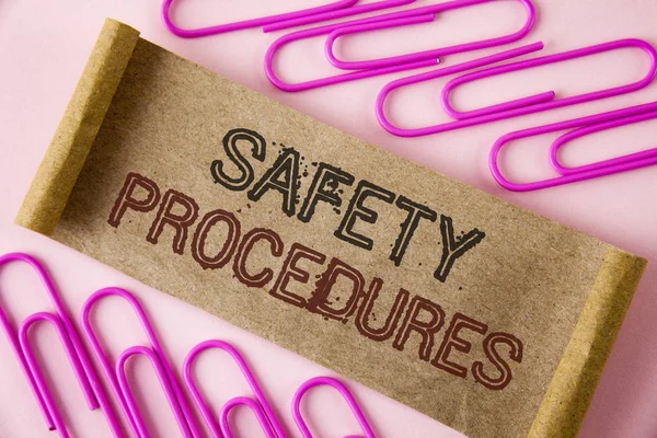 Handwriting text writing Safety Procedures. Concept meaning Follow rules and regulations for workplace security written on Folded Cardboard paper piece on plain background within Paper Pins.