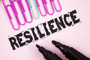 Handwriting text Resilience. Concept meaning Capacity to recover quickly from difficulties Persistence written on Plain Pink background Paper Pins and Markers next to it. clipart