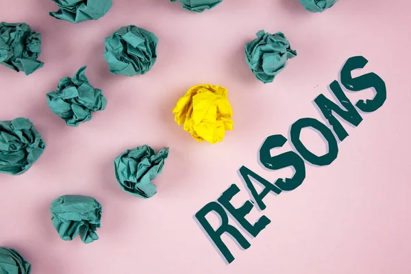Word writing text Reasons. Business concept for Causes Explanations Justifications for an action or event Motivation written on plain Pink background Crumpled Paper Balls next to it. — Stock Photo, Image