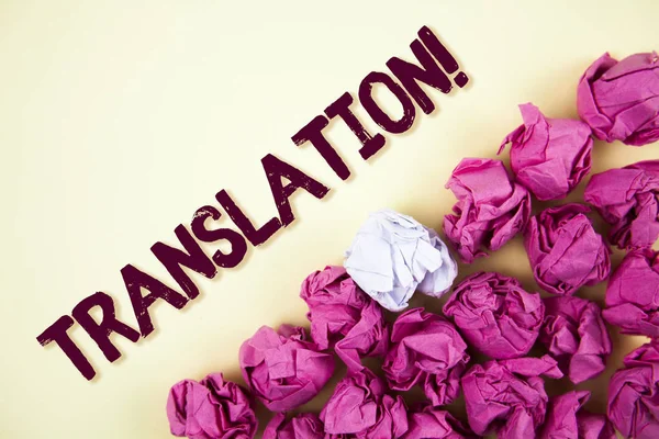 Text sign showing Translation Motivational Call. Conceptual photo Transform words or texts to another language written on Plain background Crumpled Paper Balls next to it.