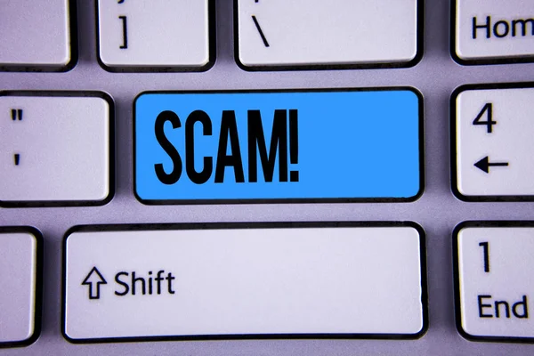 Conceptual hand writing showing Scam Motivational Call. Business photo showcasing Dishonest Act Fraud Trick People for making money written on Key Button on Keyboard with copy space. Top view. Stock Image