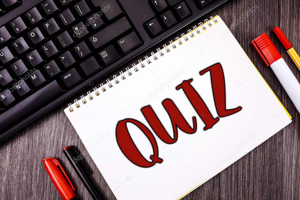 Text sign showing Quiz. Conceptual photo Short Tests Evaluation Examination to quantify your knowledge written on Notepad on wooden Grey background Marker and Black Keyboard next to it.