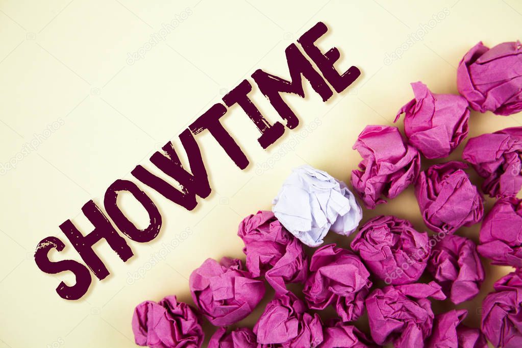 Text sign showing Showtime. Conceptual photo Time a Play Film Concert Performance Event is scheduled to start written on Plain background Crumpled Paper Balls next to it.