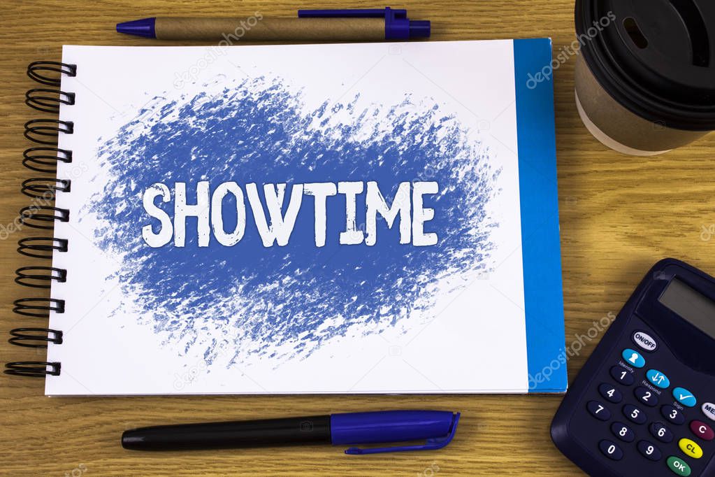 Word writing text Showtime. Business concept for Time a Play Film Concert Performance Event is scheduled to start written on Notepad on wooden background Pen Cup and Calculator next to it.