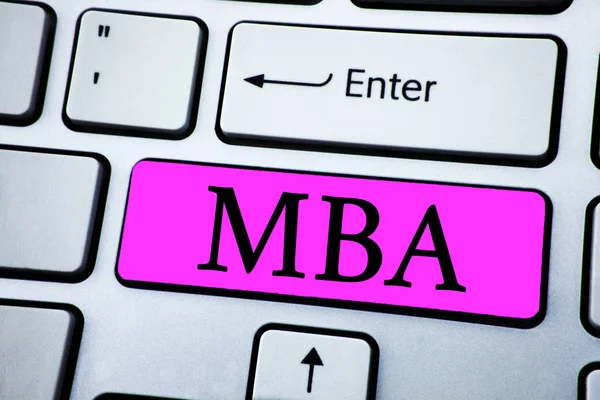 Text sign showing Mba. Conceptual photo Master of Business Administration Advance Degree After College Studies written on Pink Key Button on White Keyboard with copy space. Top view.