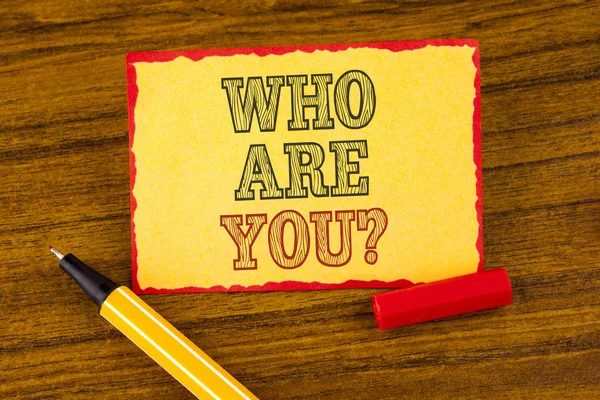 Writing note showing  Who Are You Question. Business photo showcasing Introduce or Identify Yourself Tell your Personal Story written on Sticky note paper on the Wooden background pen next to it. — Stock Photo, Image