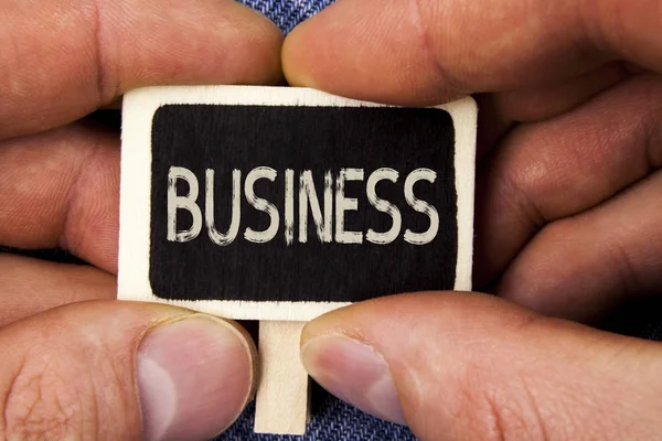 Writing note showing Business. Business photo showcasing Marketing and sales stagedy for new projects written on Wood Piece holding by man on the Blue Jeans background. — Stock Photo, Image