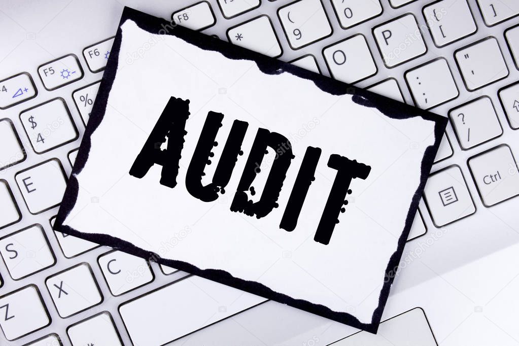 Conceptual hand writing showing Audit. Business photo showcasing Local company auditors perform their financial investigation annually written on White Sticky Note Paper placed on the Laptop.