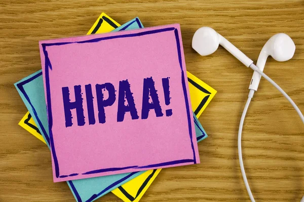 Conceptual hand writing showing Hipaa Motivational Call. Business photo showcasing Health Insurance Portability and Accountability Act written on Sticky Note Paper on wooden background Handsfree. — Stock Photo, Image