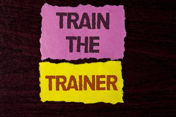 Writing note showing  Train The Trainer. Business photo showcasing Learning Technique Students being teachers themselves written on Tear Sticky Note Papers on the wooden background. — Stock Photo, Image