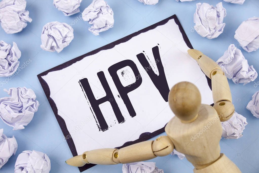 Handwriting text writing Hpv. Concept meaning Human Papillomavirus Infection Sexually Transmitted Disease Illness written on Sticky note paper within Paper Balls on Plain background Wooden Toy