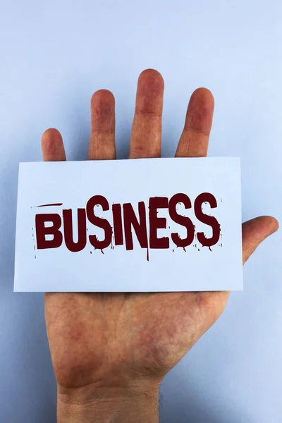 Word writing text Business. Business concept for Marketing and sales stagedy for new projects written on Sticky Note Paper placed on Hand on the plain background. — Stock Photo, Image